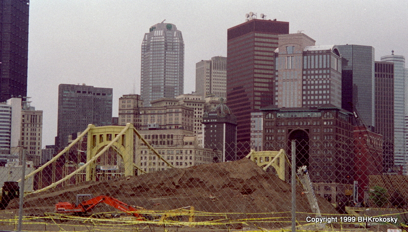 Clement bridge behind pile of dirt