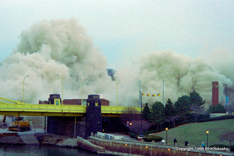 A cloud of debris replaces Three Rivers Plaza, imploded to make way for PNC Park.